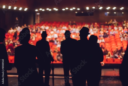 Fotomural Actors performers on stage and audience waiting for show to start,blurry image