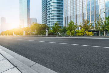 city empty traffic road with cityscape in background.