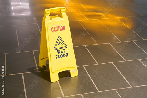 Fotografie, Obraz Slippery when wet warning sign in doors on the floor