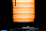 Fototapeta  - morning light through drawn blinds 
