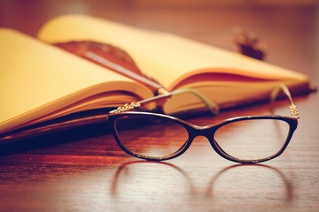 Notepad and eyeglasses