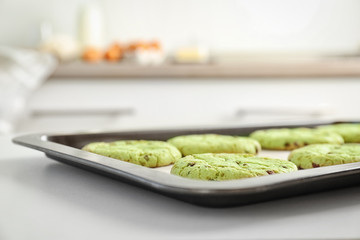 Wall Mural - Baking tray with fresh mint chocolate chip cookies on table