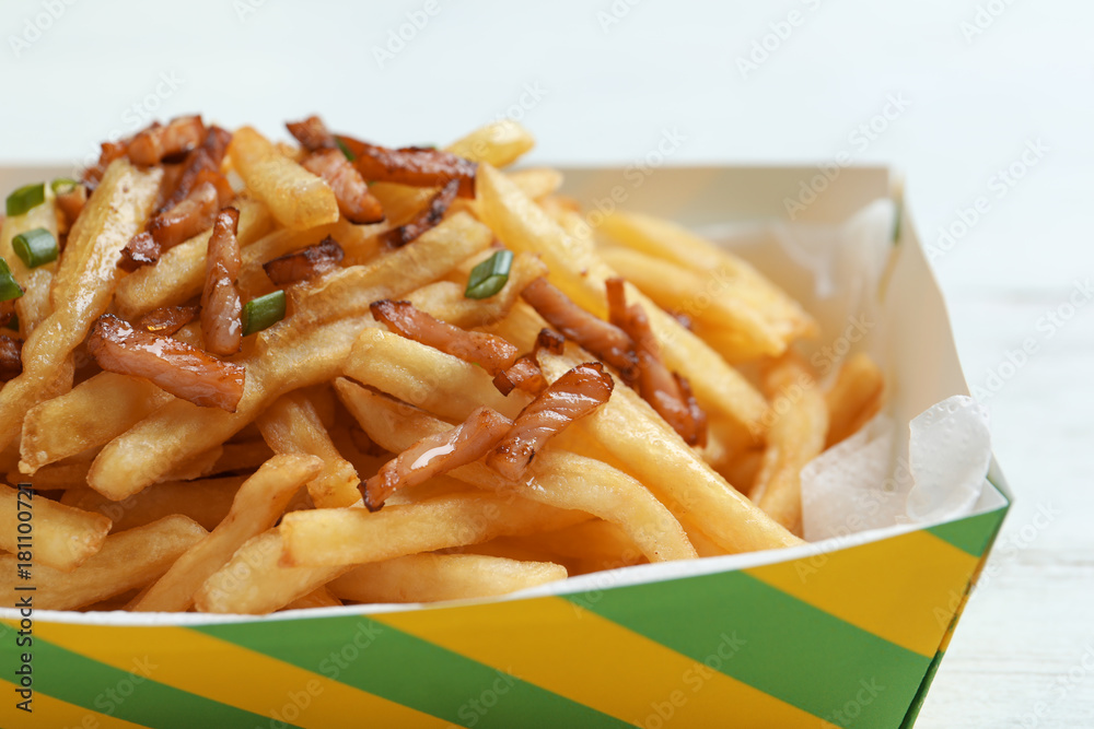 French fries with bacon in box, closeup