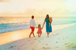 © nadezhda1906 - happy family with kids walk on sunset beach