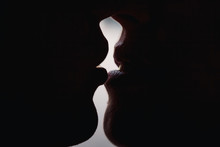 Guy And Girl Kiss Large Lips Lips Silhouettes. The Guy Is Kissing The Girl.