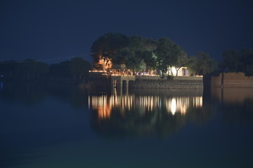 Wall Mural - night vision of temple in the bank of gadisar lake jaisalmer rajasthan india