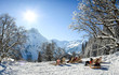 Group of people sitting with deck chairs in winter mountains. Sunbathing in snow. Germany, Bavaria, Allgau, Schwarzenberghuette.