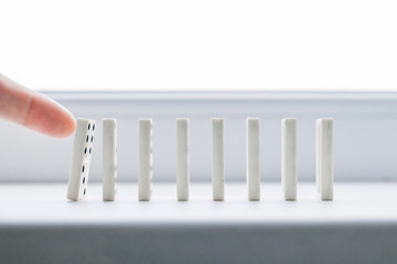 White domino, domino principle, on white background