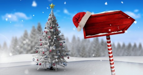 Poster - Wooden signpost in Christmas Winter landscape and Santa hat with