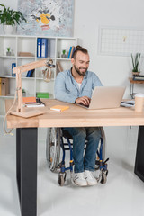 Wall Mural - businessman on wheelchair working with laptop