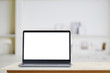 © bongkarn - Mock up Laptop : Creative designer desktop with blank white laptop. Blank screen for graphics display montage.
