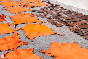 leather slices drying out at marrakech street, morocco