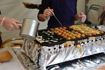 the cook pours a dough for Japanese balls