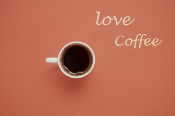 Wall Mural - morning coffee cup on pastel background  top view