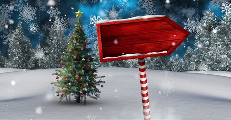 Poster - Wooden signpost in Christmas Winter landscape with Christmas