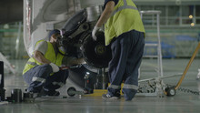 Replacement Landing Gear. Working Staff Has Been Working To Repair The Chassis Of A Passenger Plane