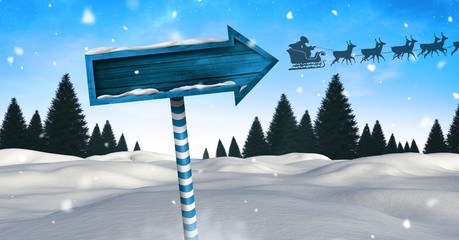 Sticker - Wooden signpost in Christmas Winter landscape and Santa's sleigh