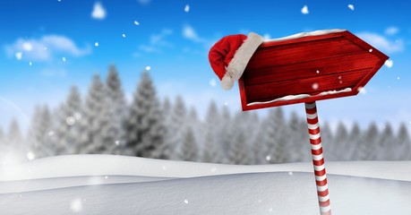 Poster - Wooden signpost in Christmas Winter landscape and Santa hat