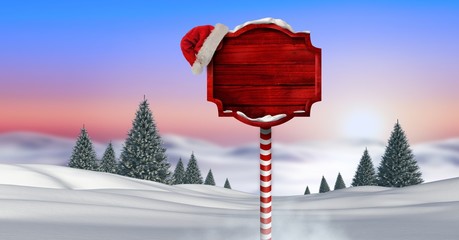 Wall Mural - Wooden signpost in Christmas Winter landscape and Santa hat