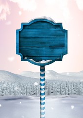 Poster - Wooden signpost in Christmas Winter landscape