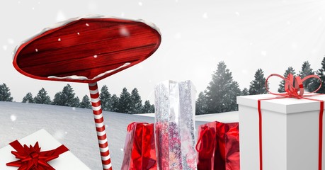 Poster - Wooden signpost and Gifts in Christmas Winter landscape