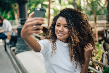 Self portrait of beautiful young woman with afro hairstyle.