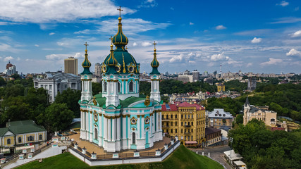 Aerial top view of Saint Andrew's church and Andreevska street from above, cityscape of Podol district, city of Kiev (Kyiv), Ukraine
