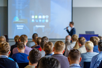 audience listens to the lecturer at the conference hall