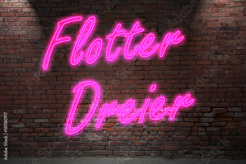 Fotografía Leuchtreklame Flotter Dreier an Ziegelsteinmauer