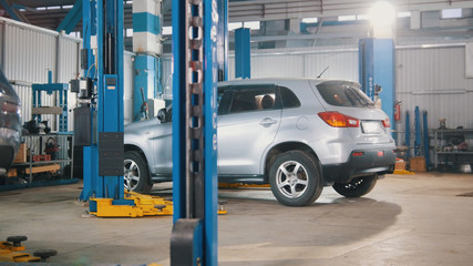 Car preparing for professional diagnostics in auto service, close up