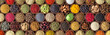 Leinwandbild Motiv Different seasonings in cups. Spice background on the table