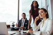 © Jacob Lund - Woman with colleagues during a meeting in office