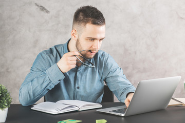 Wall Mural - Attractive guy working on project