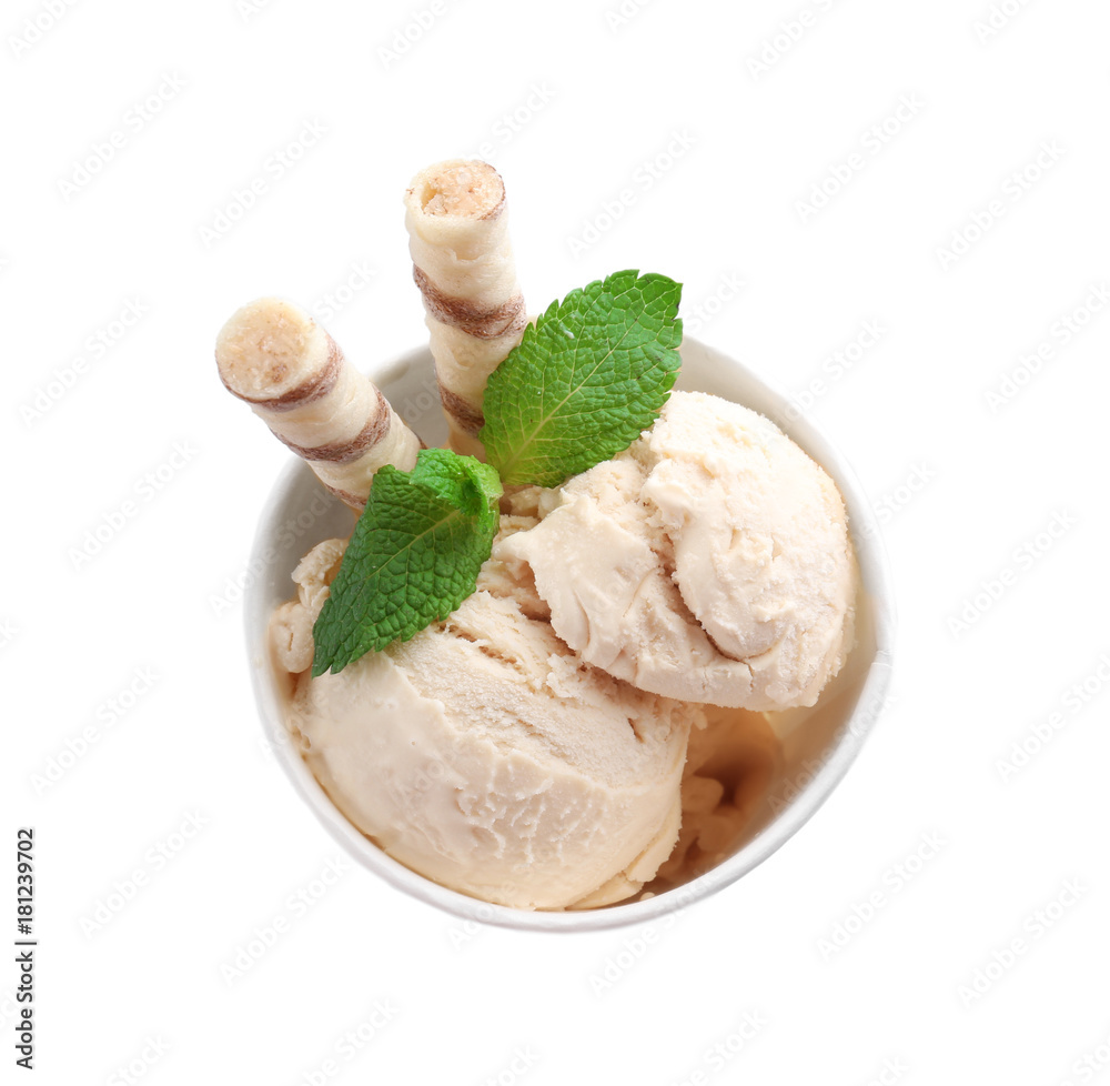 Plastic cup with caramel ice cream on white background