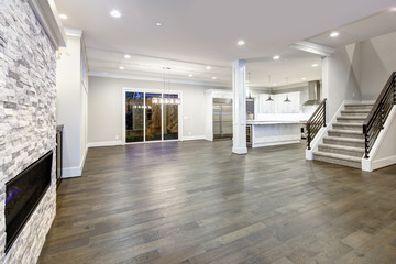 Spacious empty living room interior in white and gray colors.