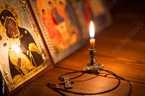 Cuadros en Lienzo burning candle in a dark room, orthodox