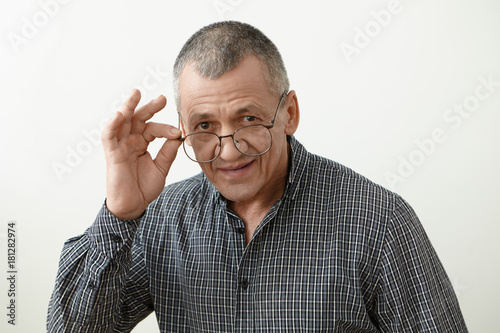 Headshot Of Attractive Smoothly Shaven 60 Year Old Retired Man