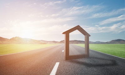 Conceptual background image of concrete home sign on asphalt road