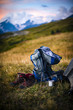 The backpack stands on the background of high mountains. Around the wonderful landscape. Evening. Sunset. Tourism in the Caucasian Mountains in Georgia.