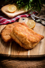 Two fried cod fillet pieces.