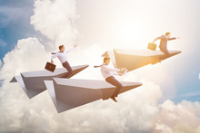 Businessman Flying On Paper Plane In Business Concept