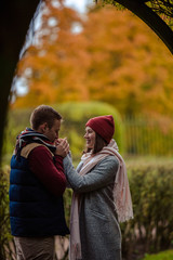 Wall Mural - Beautiful pair of lovers walking in the autumn Park  