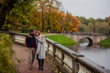 Wall Mural - Beautiful pair of lovers walking in the autumn Park  