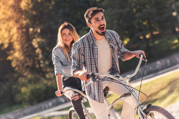 Wall Mural - Couple with a tandem bicycle