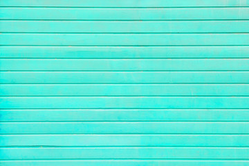 Horizontal  wooden planks painted turquoise as background, texture