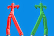 Two inflatable man. Green and Red. Choices concept