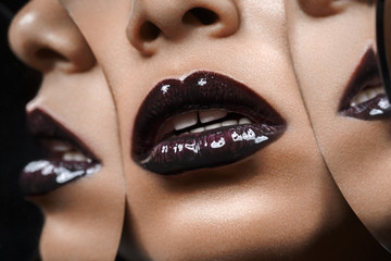 beautiful woman lips closeup with mirror reflections