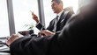© Jacob Lund - Smiling businessman during a meeting in office