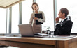 © Jacob Lund - Two business professional working together in office