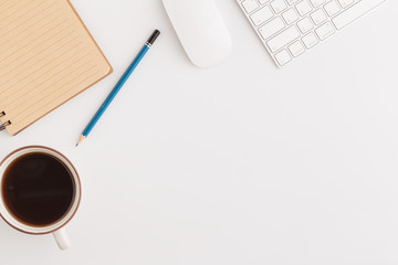 Wall Mural - flat lay photo of office desk with mouse and keyboard,copy space on white background with coffee and